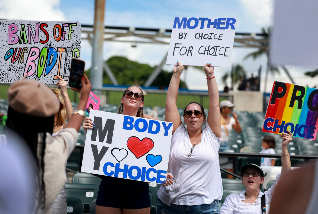 People attend a reproductive rights rally in Florida.