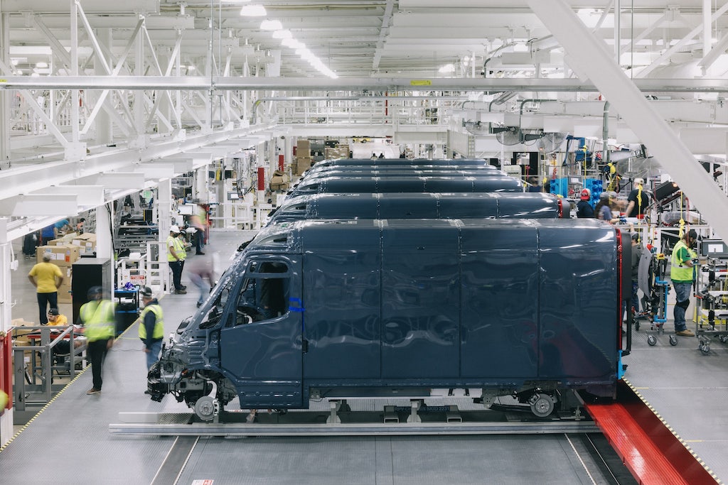 Employees work at a Rivian electric vehicle factory in Normal, Ill.