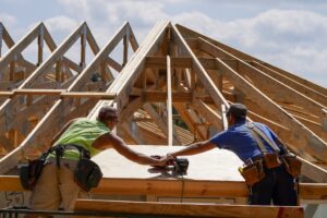 Workers build a home.