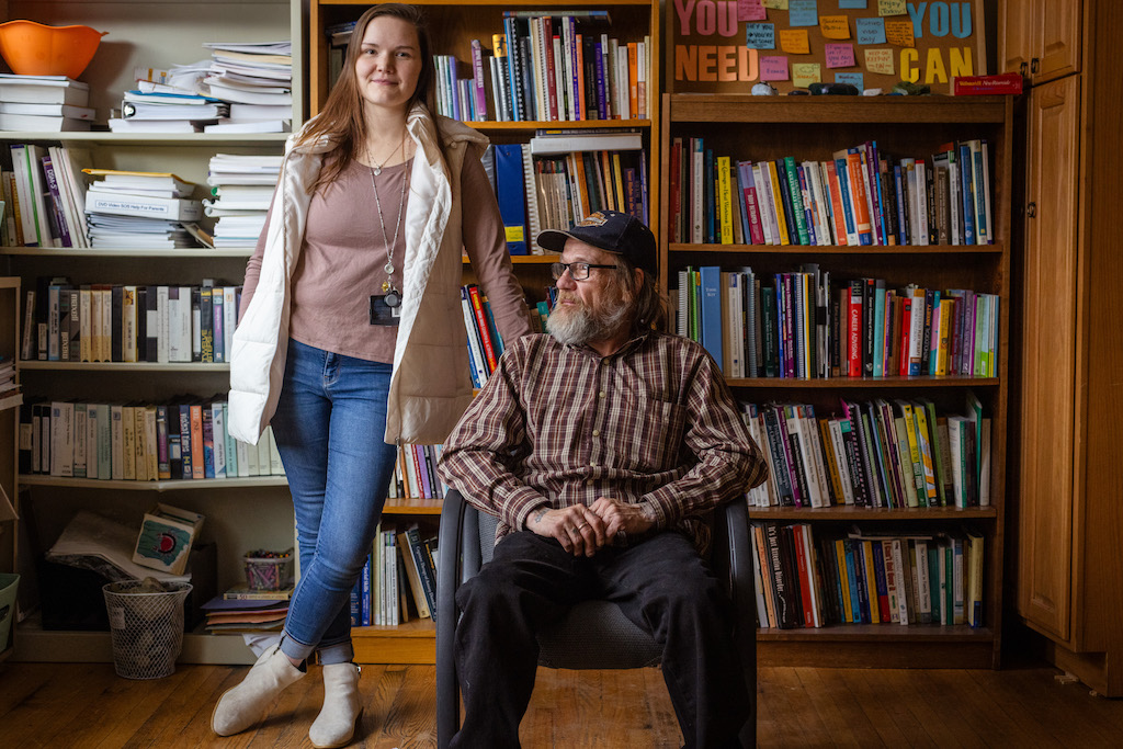 A man and woman pose for a photo.