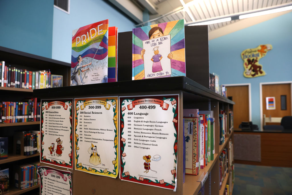 Newly donated LGBTQ+ books are displayed in the library at a California public school library.