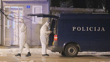 Police investigators work at the site of a shooting in Cetinje, 36 kilometers (22 miles) west of Podogrica, Montenegro, Wednesday, Jan 1, 2025