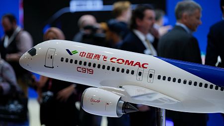 An aircraft model of China's COMAC C919 is on display at the COMAC pavilion during the first day of the Singapore Airshow in Singapore, Tuesday, Feb. 20, 2024. 