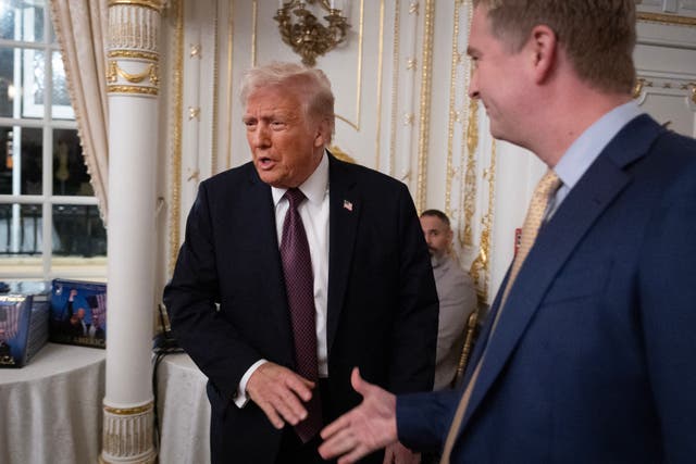 <p>US President-elect Donald Trump greets guests as he arrives for a meeting with Republican governors at the Mar-a-Lago Club on January 09, 2025 in Palm Beach, Florida</p>