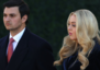 Tiffany Trump wraps herself in a navy blue floor-length coat dress for Trump's inauguration