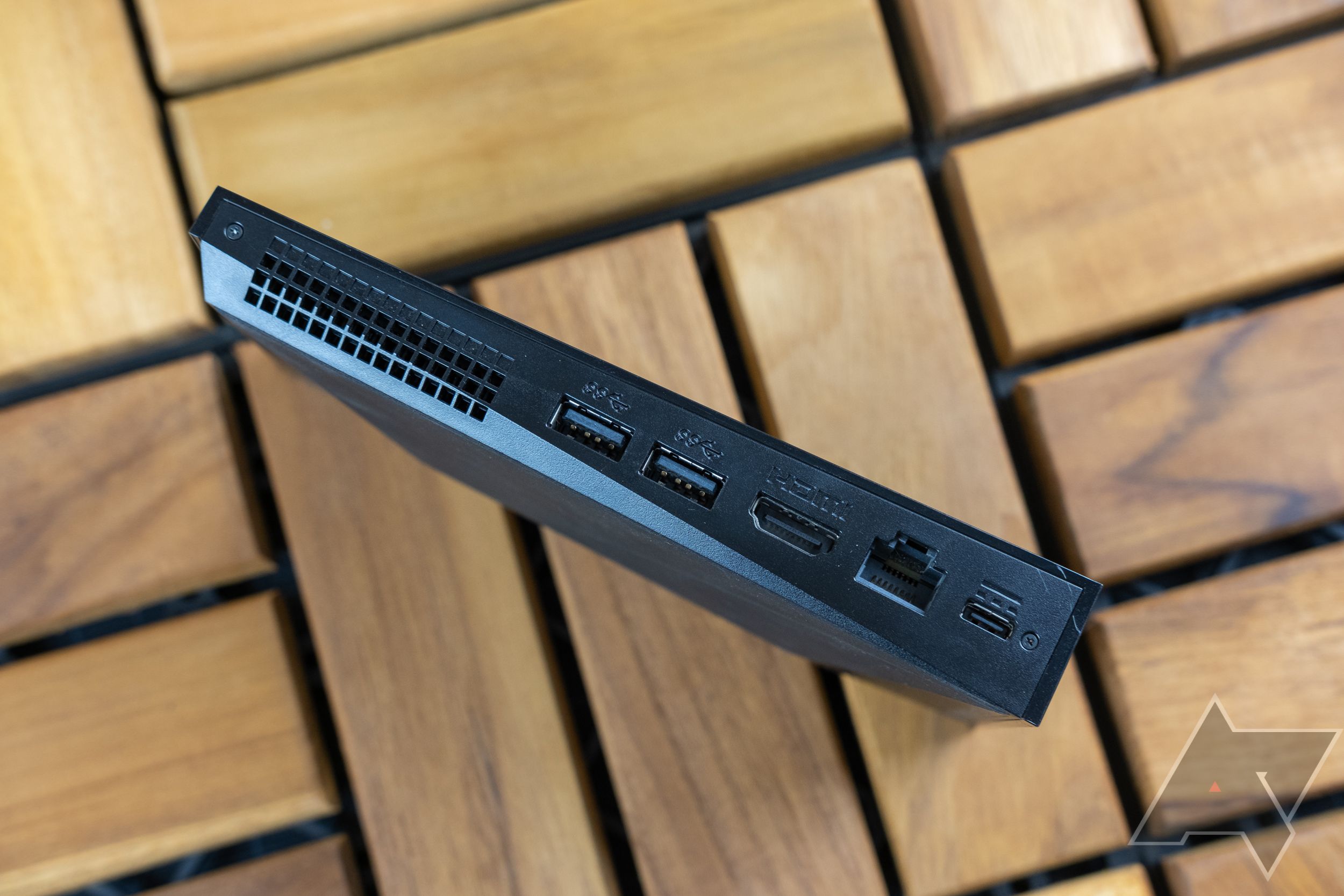 An image of the NVIDIA Shield streaming device showing all of its avaiable ports on a wooden surface background.