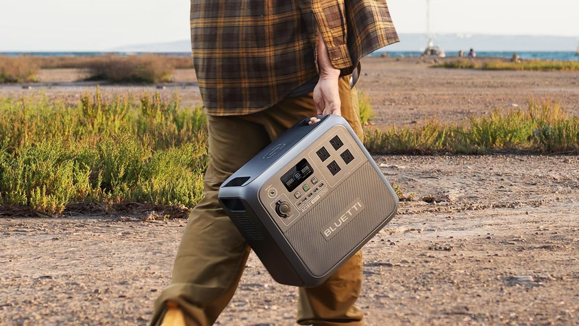 Carrying the Bluetti AC180 on a dirt road.