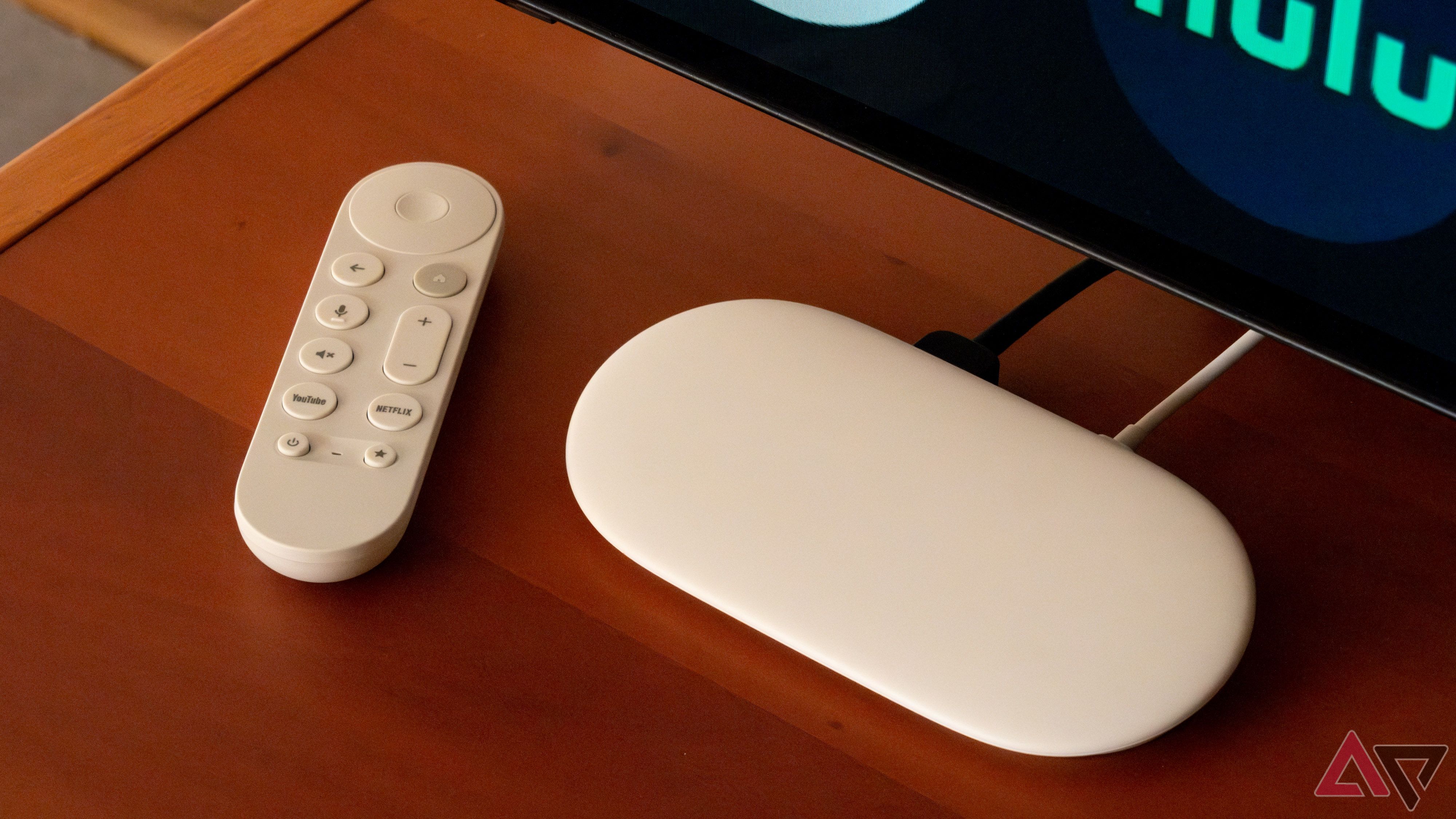 The Google TV Streamer under a TV.