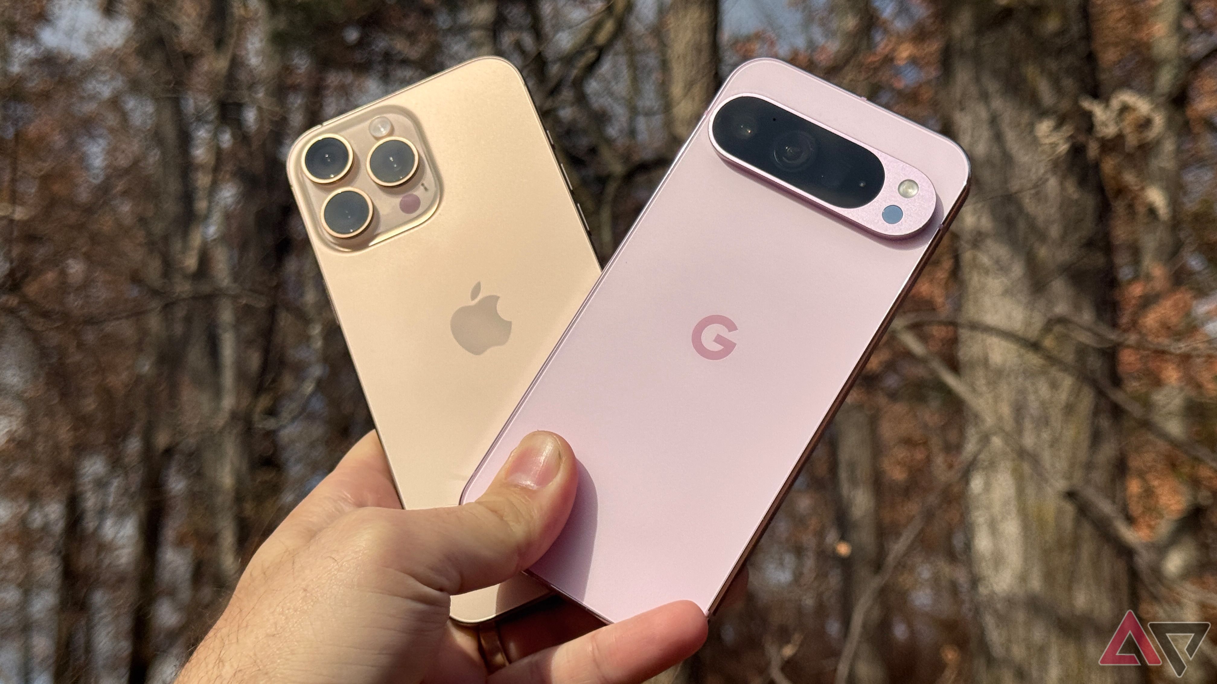 A hand holding an iPhone 16 Pro and a Pixel 9 Pro.