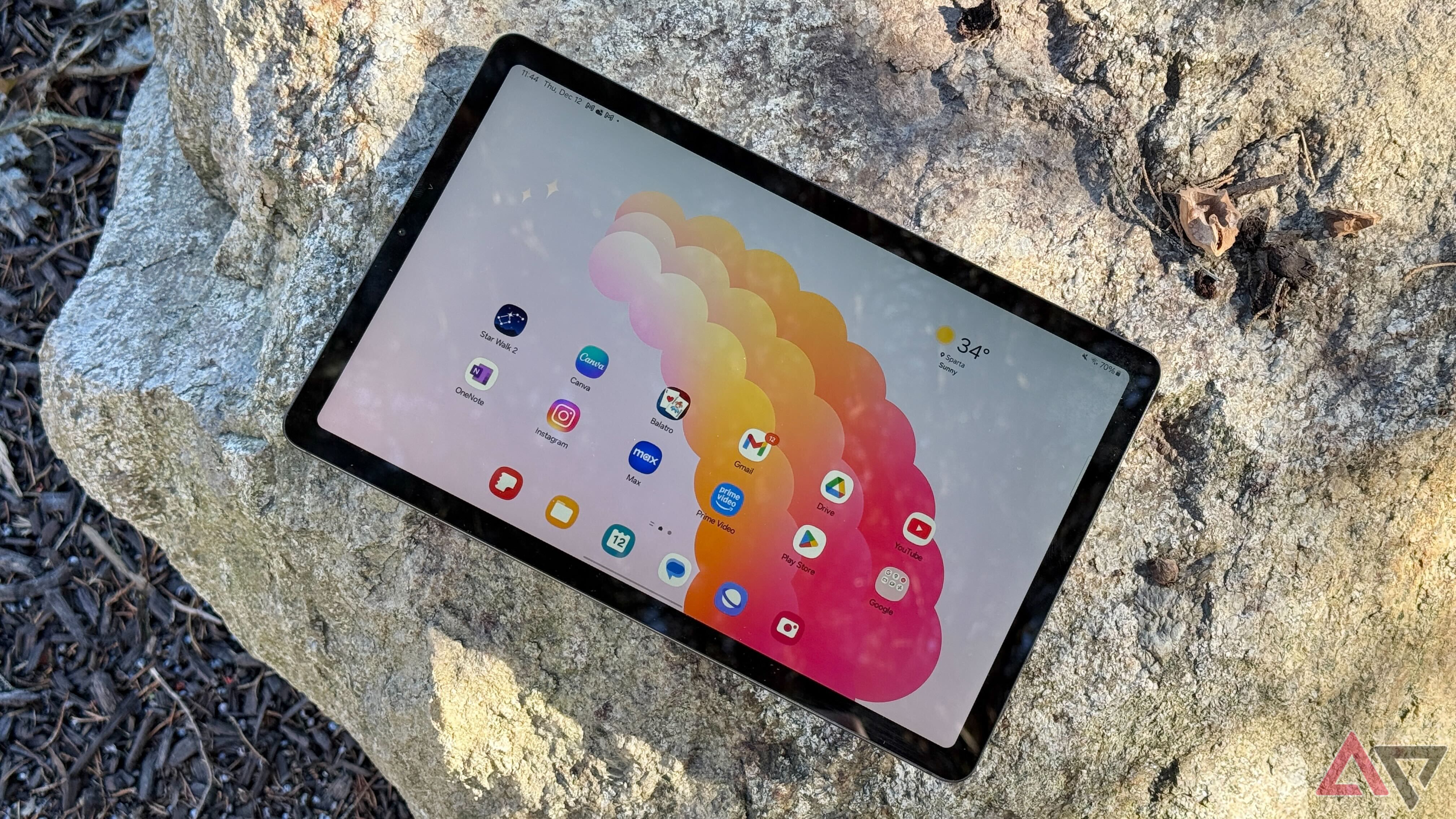 Galaxy Tab S6 Lite outdoors on a rock on a very sunny day