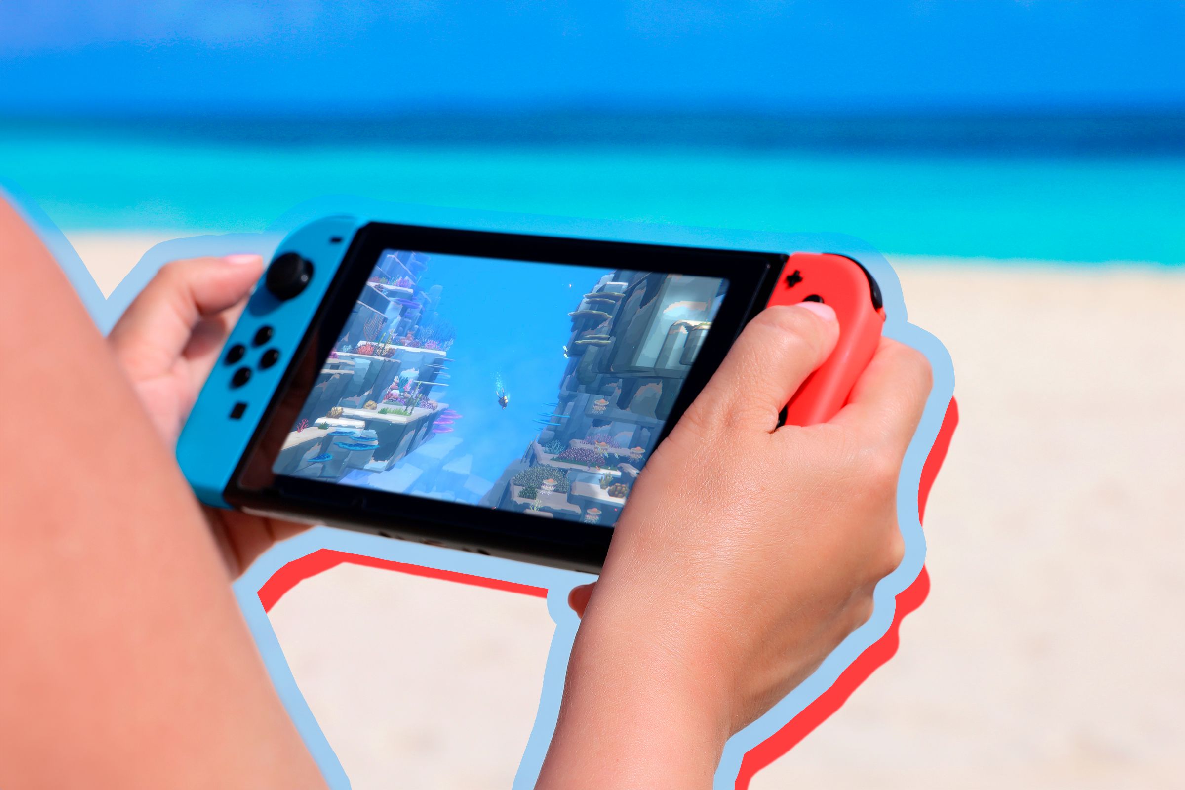 Person on the beach playing a game on Nintendo Switch.