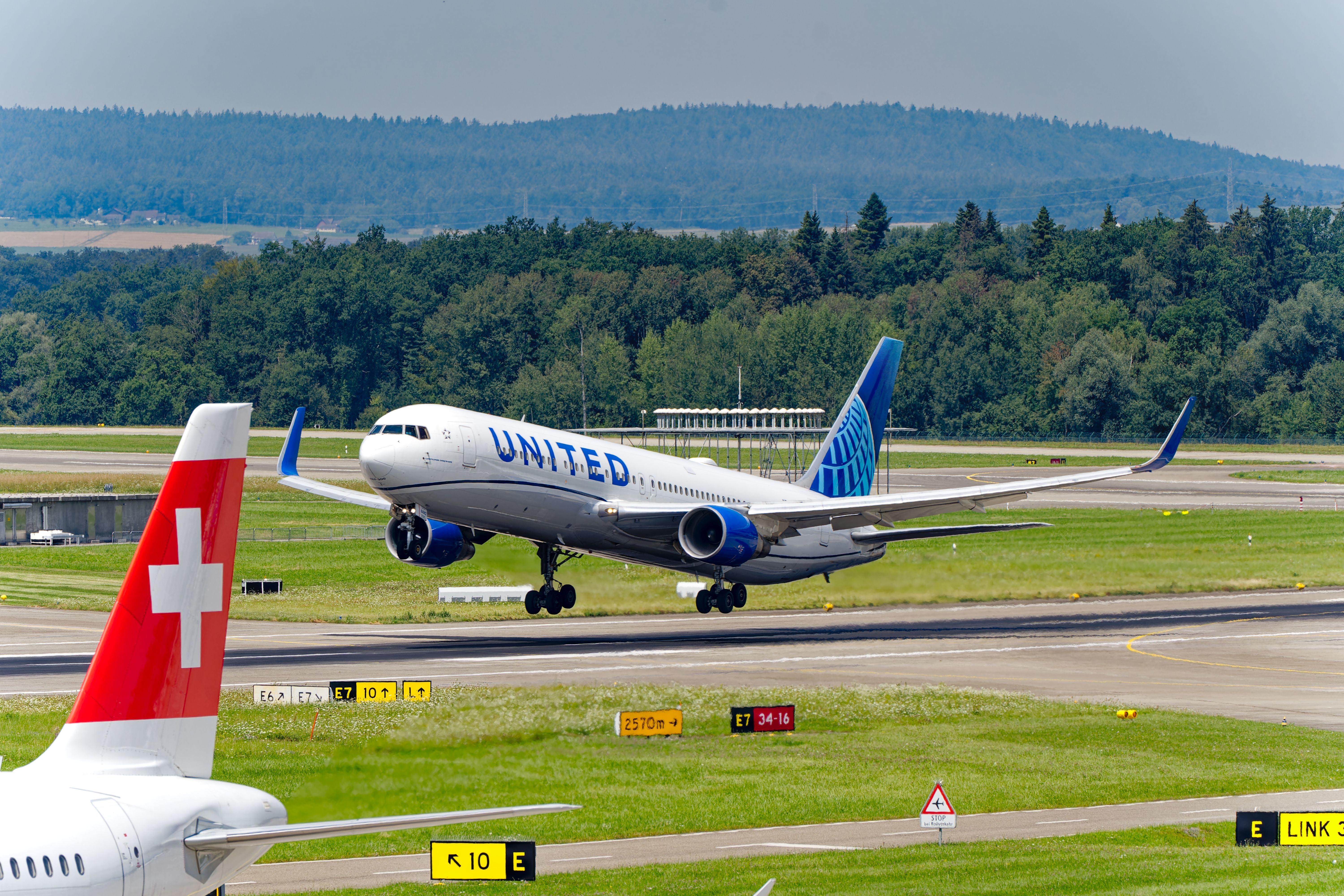 United Airlines Boeing 767-300 N675UA airplane taking off from Swiss airport Zürich Kloten on a sunny summer noon. Photo taken July 30th, 2024, Zurich, Switzerland.