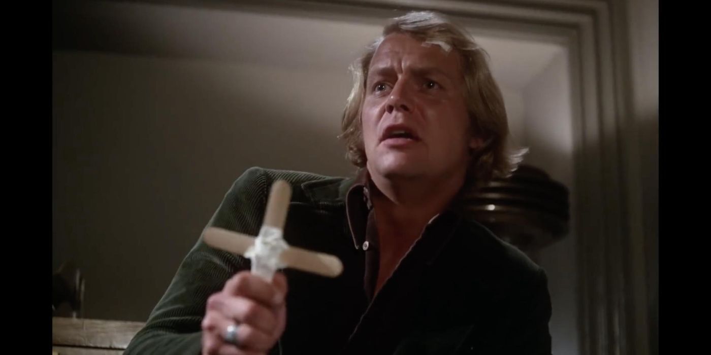 Ben Mears (David Soul) holding up a crucifix in Salem's Lot.