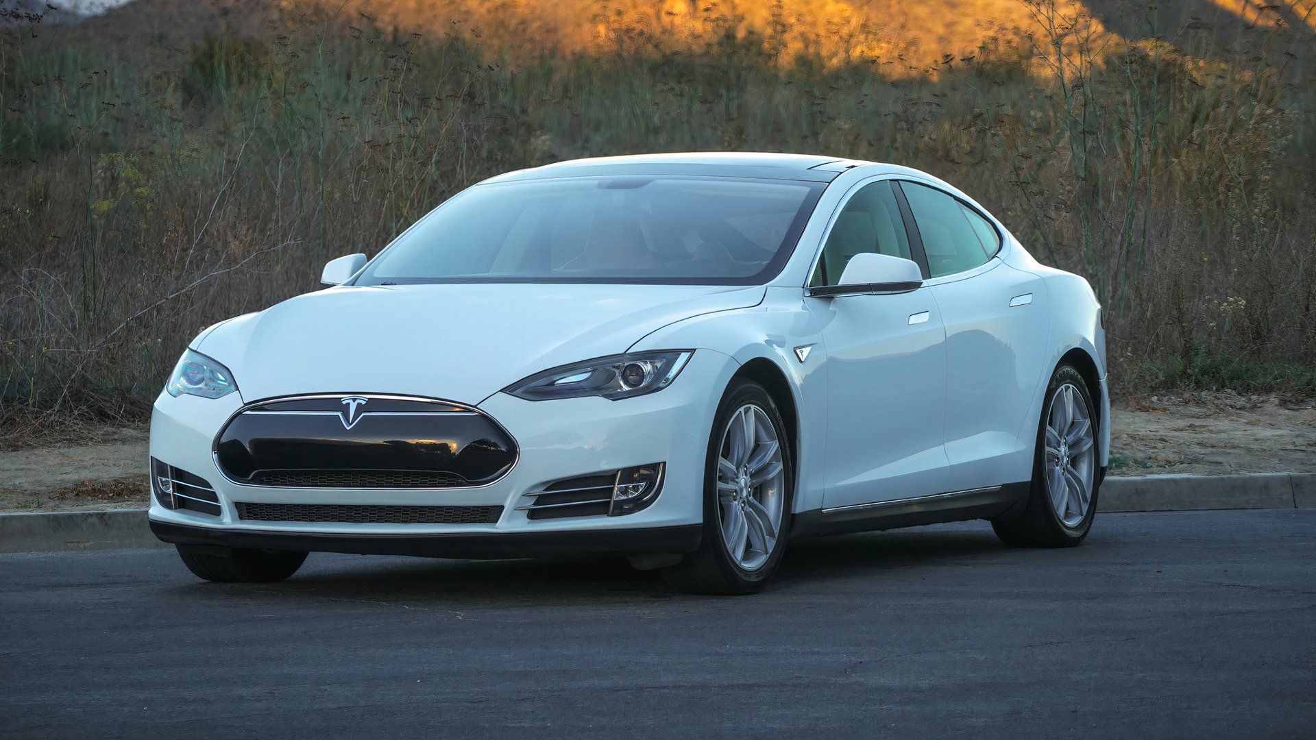 Front three-quarters shot of a white 2013 Tesla Model S