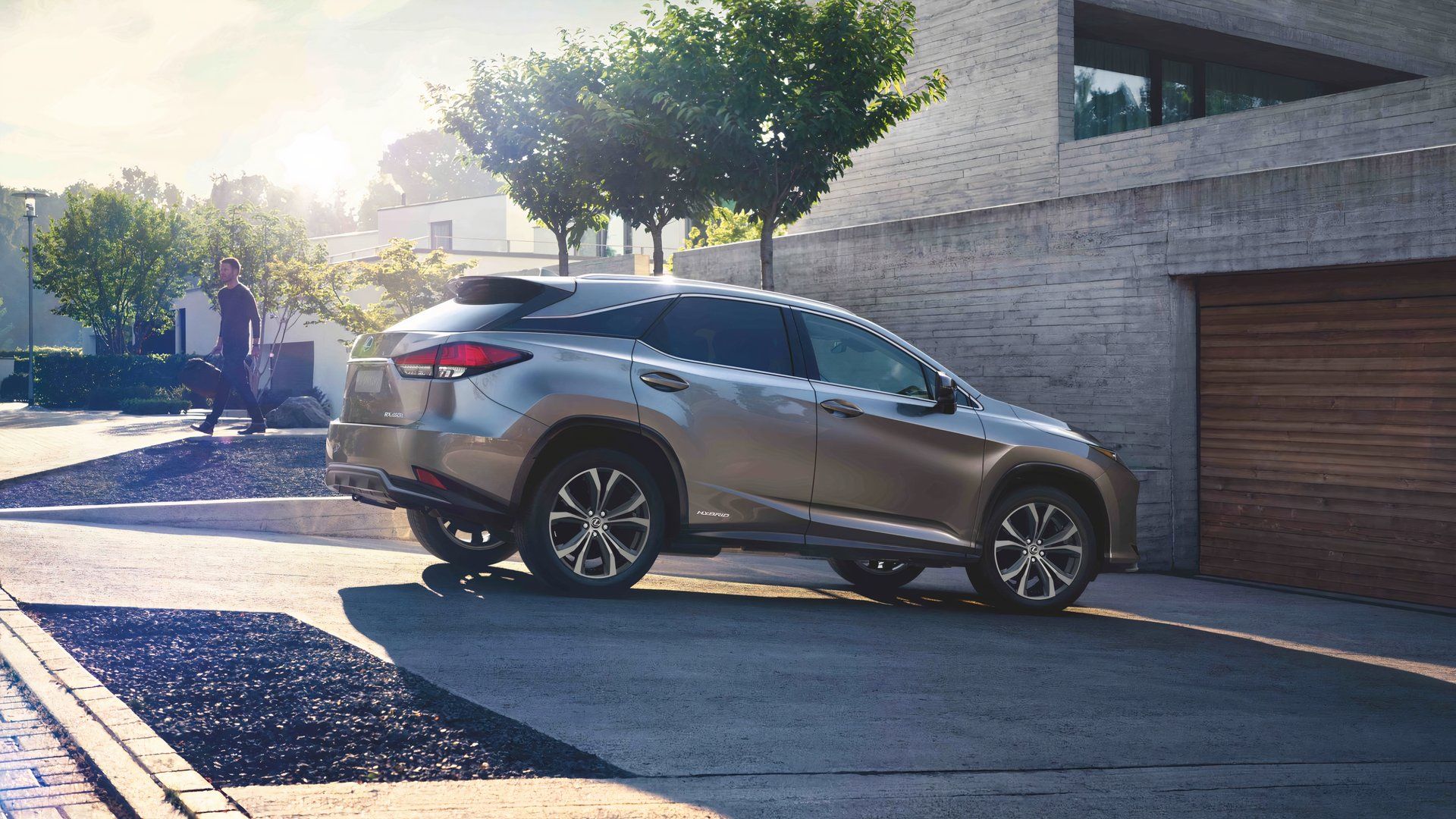 Side profile shot of a silver 2022 Lexus RX450h Hybrid