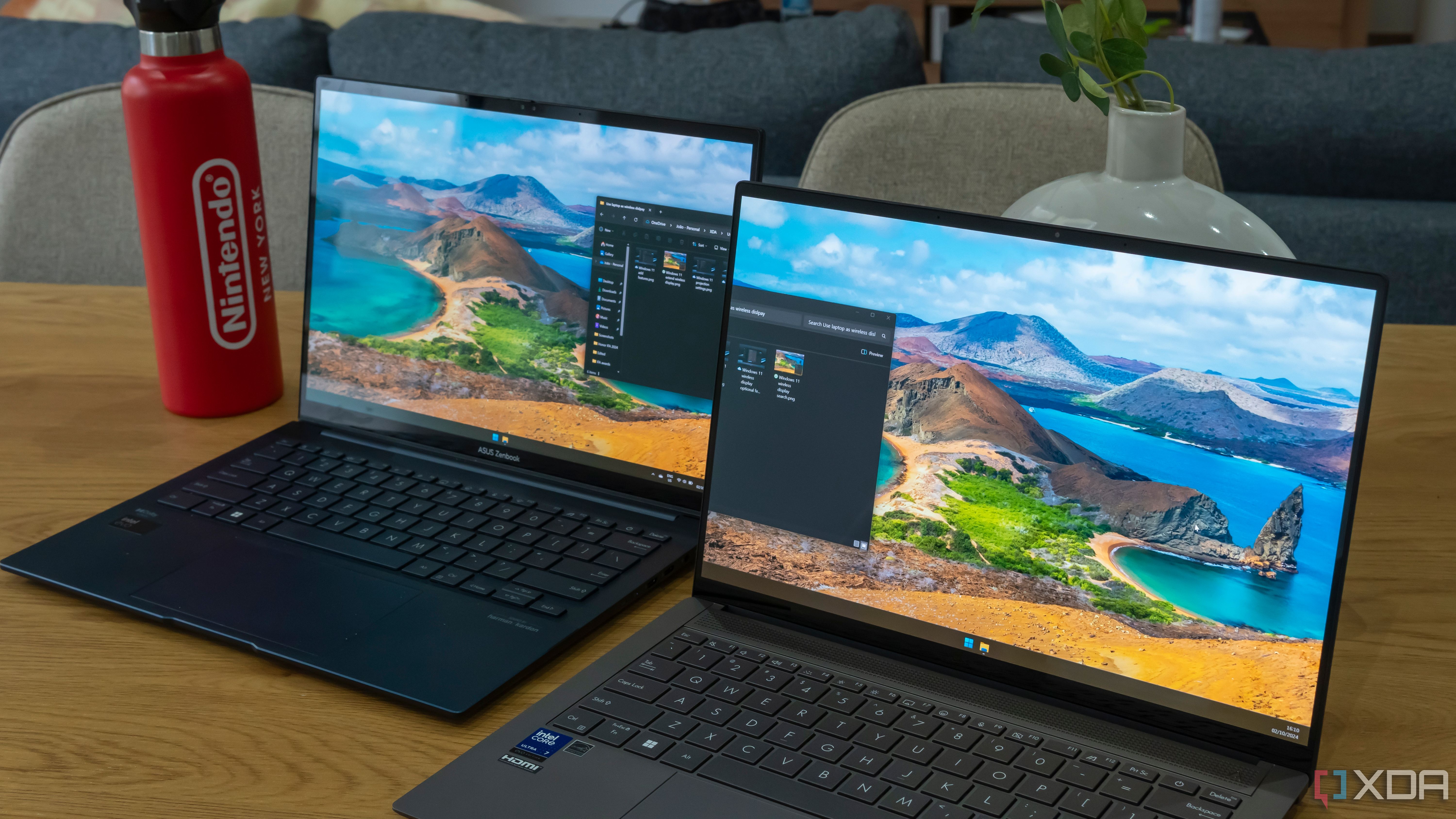 Two Windows 11 laptops next to each other with one being used as an extension of the display on the other