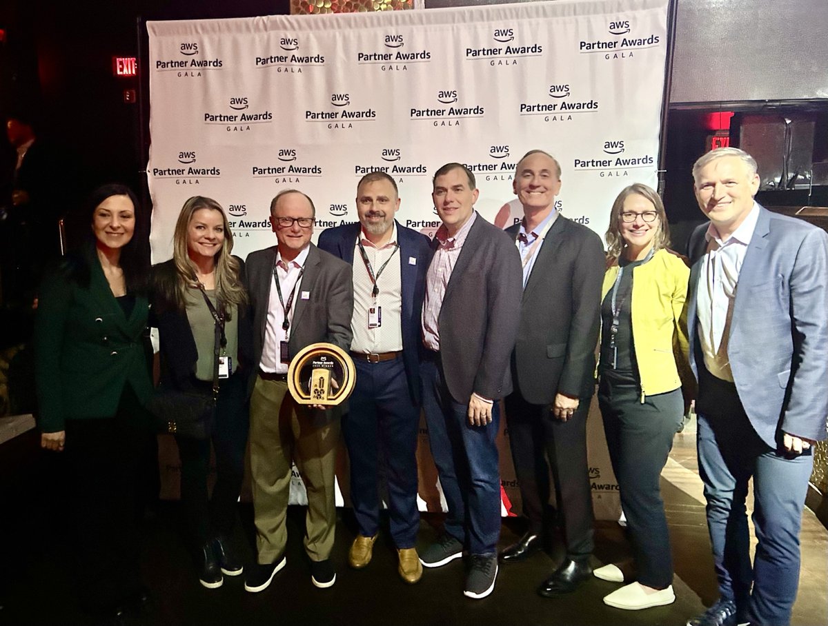 photo of a group of people accepting the ISV Partner of the year award at AWS:reinvent