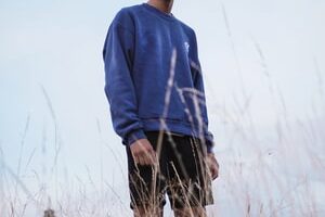 man in blue sweater