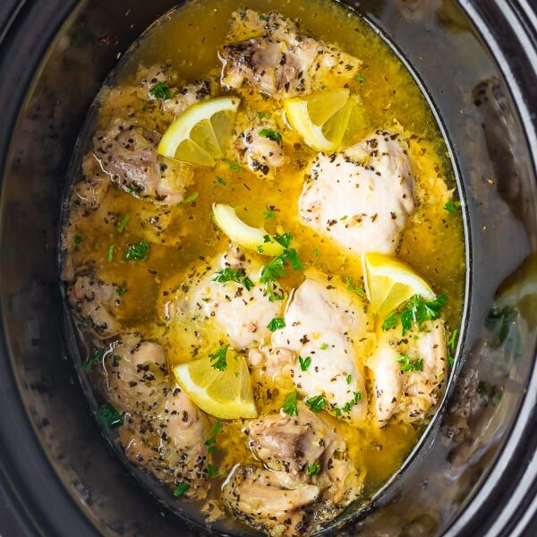 overhead shot of lemon garlic chicken thighs in slow cooker