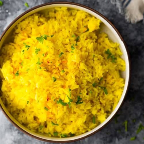 overhead shot of saffron rice in large bowl