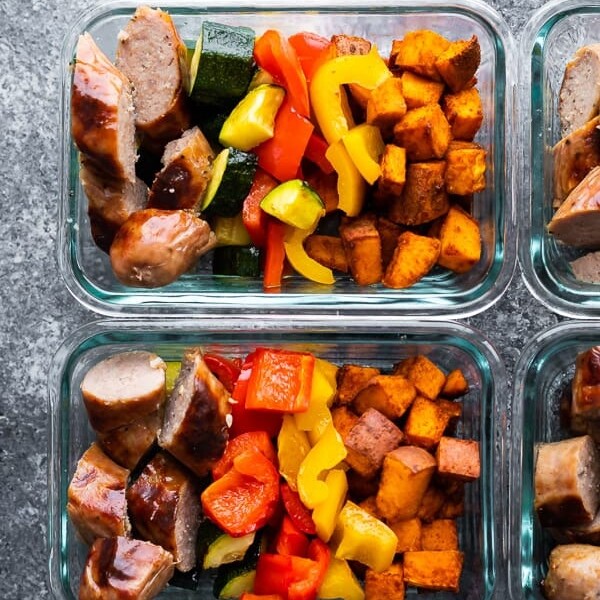 overhead image of glass meal prep containers filled with sheet pan breakfast bake