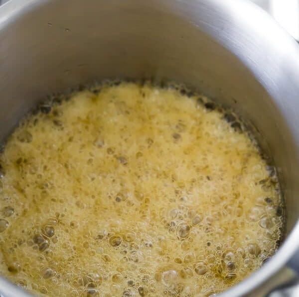 simmering honey and coconut oil to make healthy granola bars