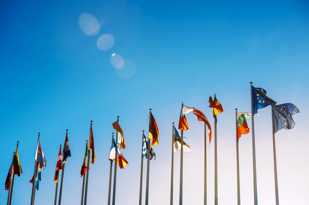 European Union flags against blue sky