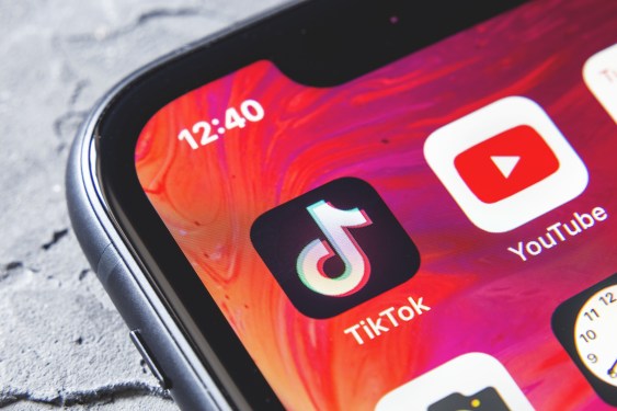 TikTok and YouTube apps on screen iphone xr, close up