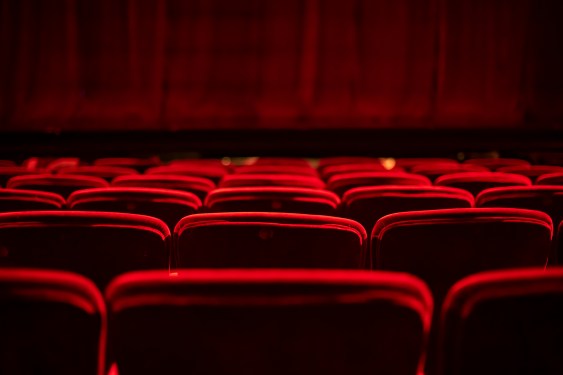 Red seats and curtains of an empty theater