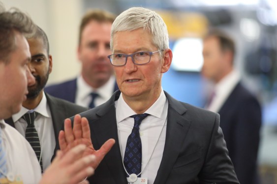 Tim Cook, chief executive officer of Apple Inc., walks between sessions on day two of the World Economic Forum (WEF) in Davos, Switzerland.