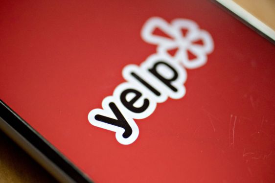 The Yelp Inc. application is displayed on for a photograph an iPhone.