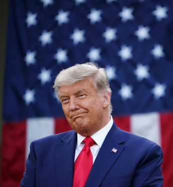 Trump in front of flag