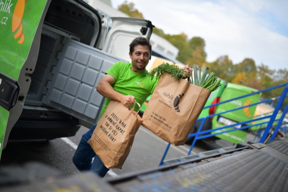 man delivering bags of groceries