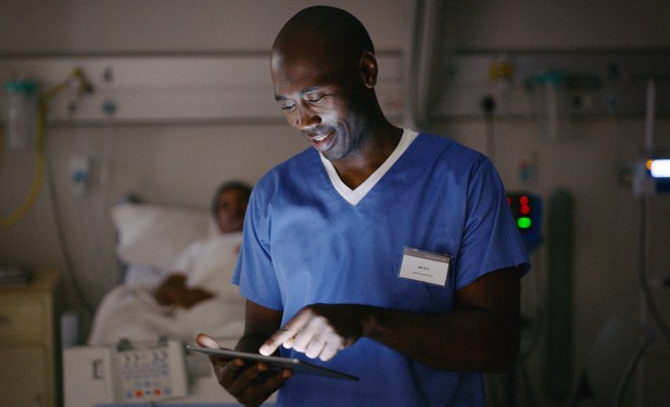 Shot of a medical practitioner using a digital tablet in a hospital ward