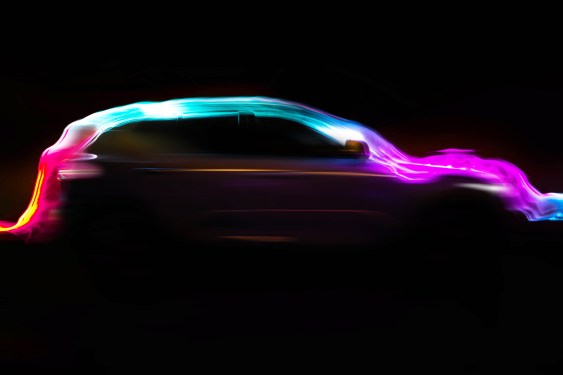 Image of a silhouette of a car in rainbow colors.