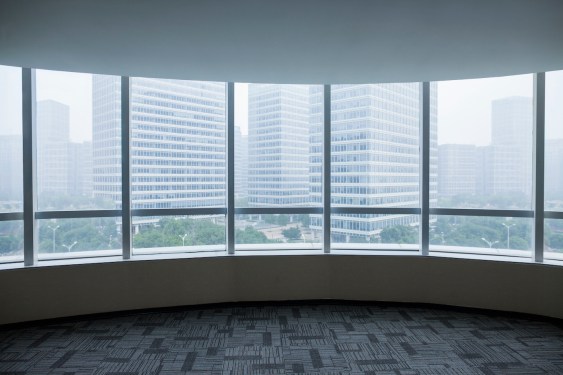 View of urban cityscape from empty business office