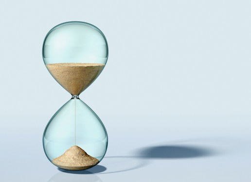 an hourglass filled with sand measures the passage of time