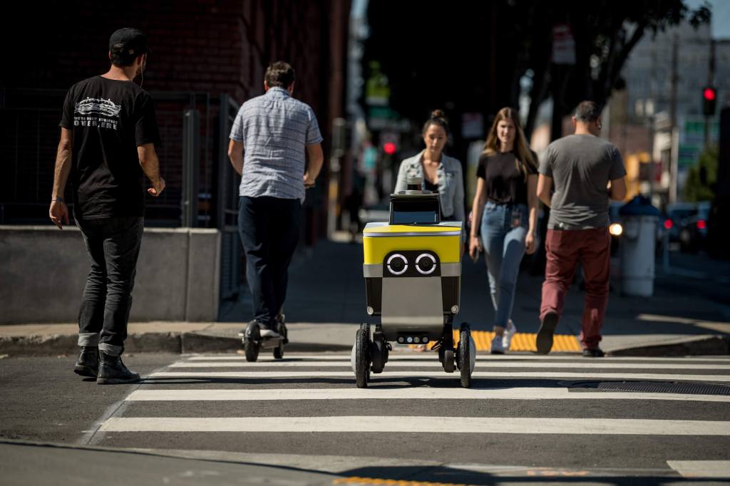 Serve Robotics sidewalk delivery robot crossing street; company closed seed round with uber, 7-eleven, delivery hero as investors