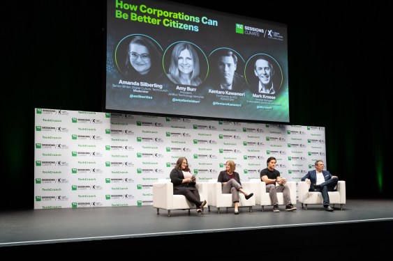 Four people sit on a panel with a title card above that says "how corporations can be better citizens"