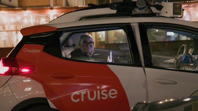 Woman getting into autonomous Cruise ride-hailing vehicle in San Francisco