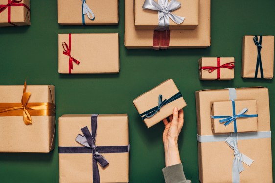 hand holding multiple gift-wrapped boxes. unbundled databases