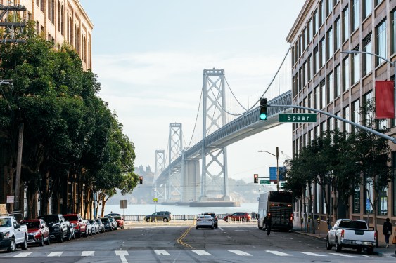 The San Francisco - Oakland Bay Bridge and street in San Francisco, California, USA as viewed from Harrison Street looking east