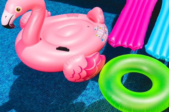 inflatable pool toys sitting on top of pool