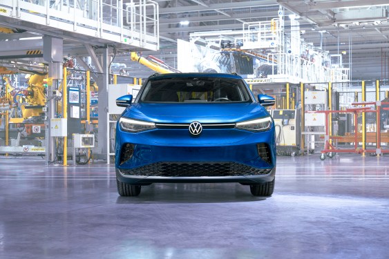 Front of a blue 2023 VW ID4 parked in a factory.