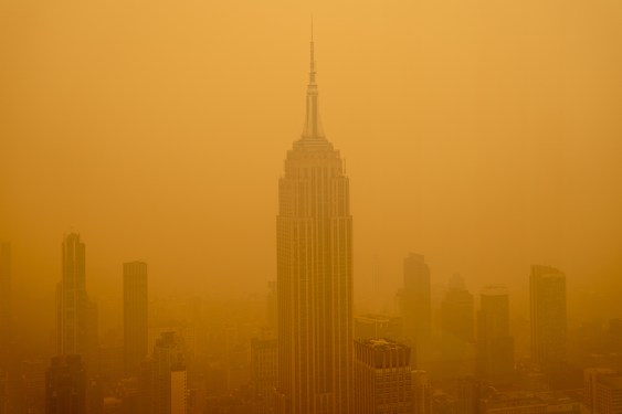 Smoke envelopes the Empire State Building