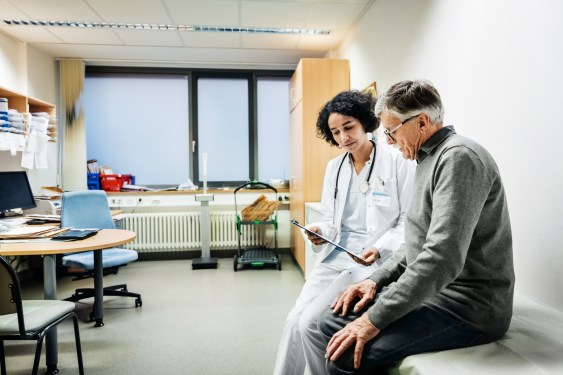 An elderly man talking to his doctor about some recent test results, used in post about Fold Health