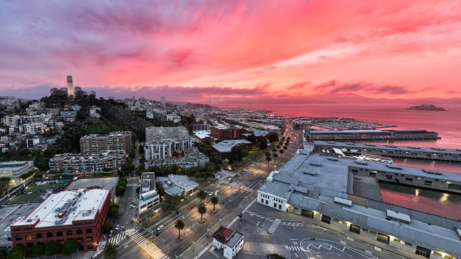 Coit Tower 90th Anniversary--The "Candle" laser light show instalation part of the Illuminate non-profit group lit up the night sky, from Coit Tower in San Francisco with eight lasers beaming towards the heavens. .The instalation is part of it's "Summer of Awe" series.