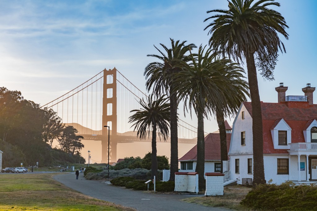 Houses Palm Trees near Golden Gate Bridge at Sunset on a warm summer evening