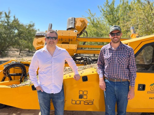 Bonsai Robotics founders in front of autonomous ag equipment