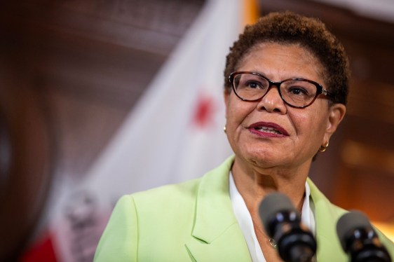 Los Angeles Mayor Karen Bass standing at a podium.